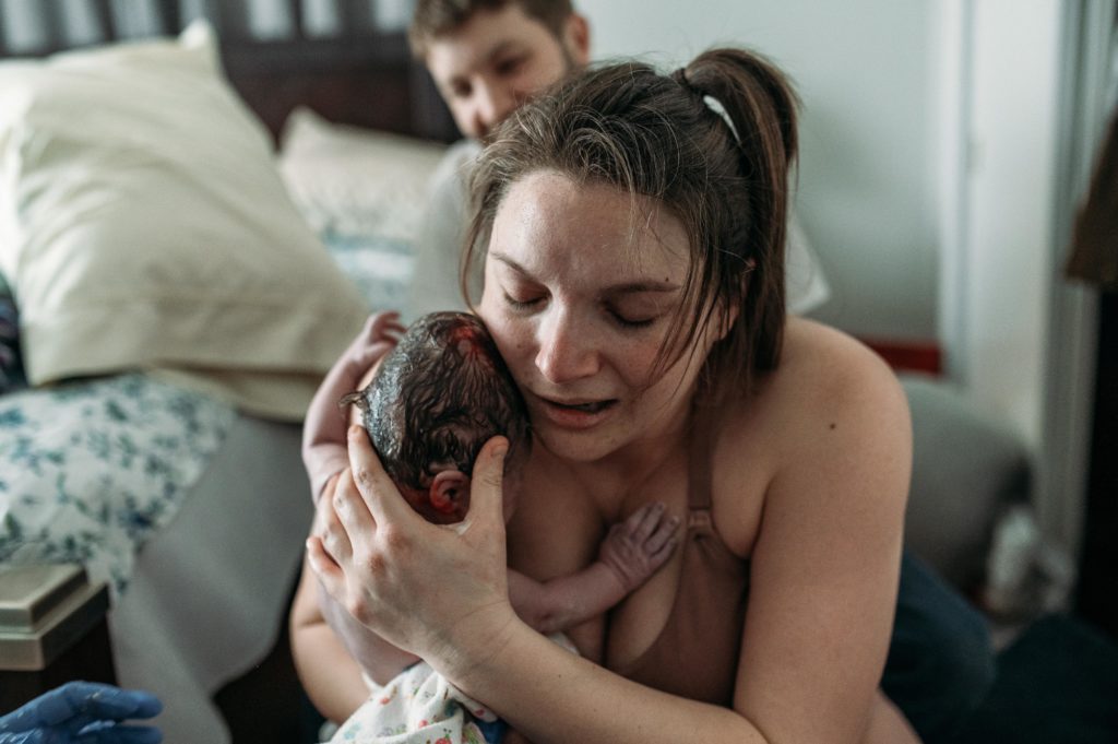 embracing baby after being alone in the hospital for several hours