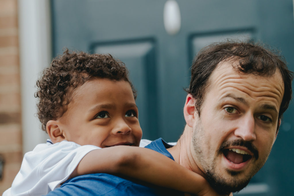 this father loves playing with the kids and the family dog and a soccer ball.