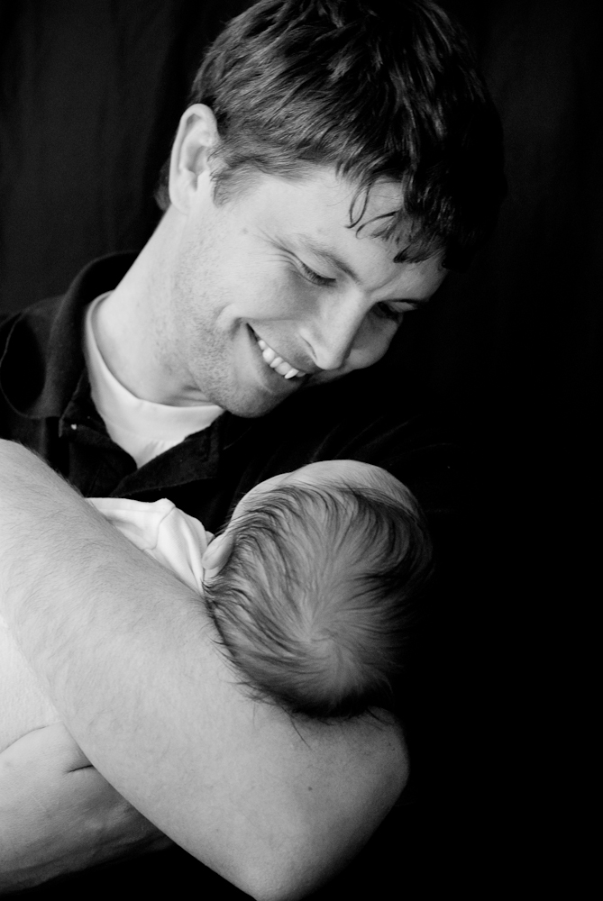 a dad holding his son to start building a relationship that lasts forever.